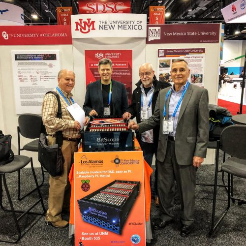 Bruce Tulloch at a conference stand with a demo of the Raspberry Pi cluster for LANL 