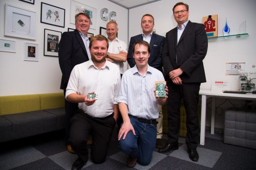 The team behind the power supply chip on the Raspberry Pi 3 Model B+ (group of six men, two of whom are holding Raspberry Pi boards)