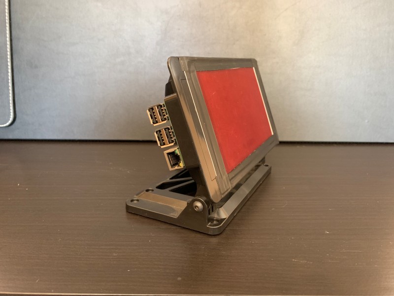 Raspberry Pi in a case with a red plastic overlay so it can be used at night